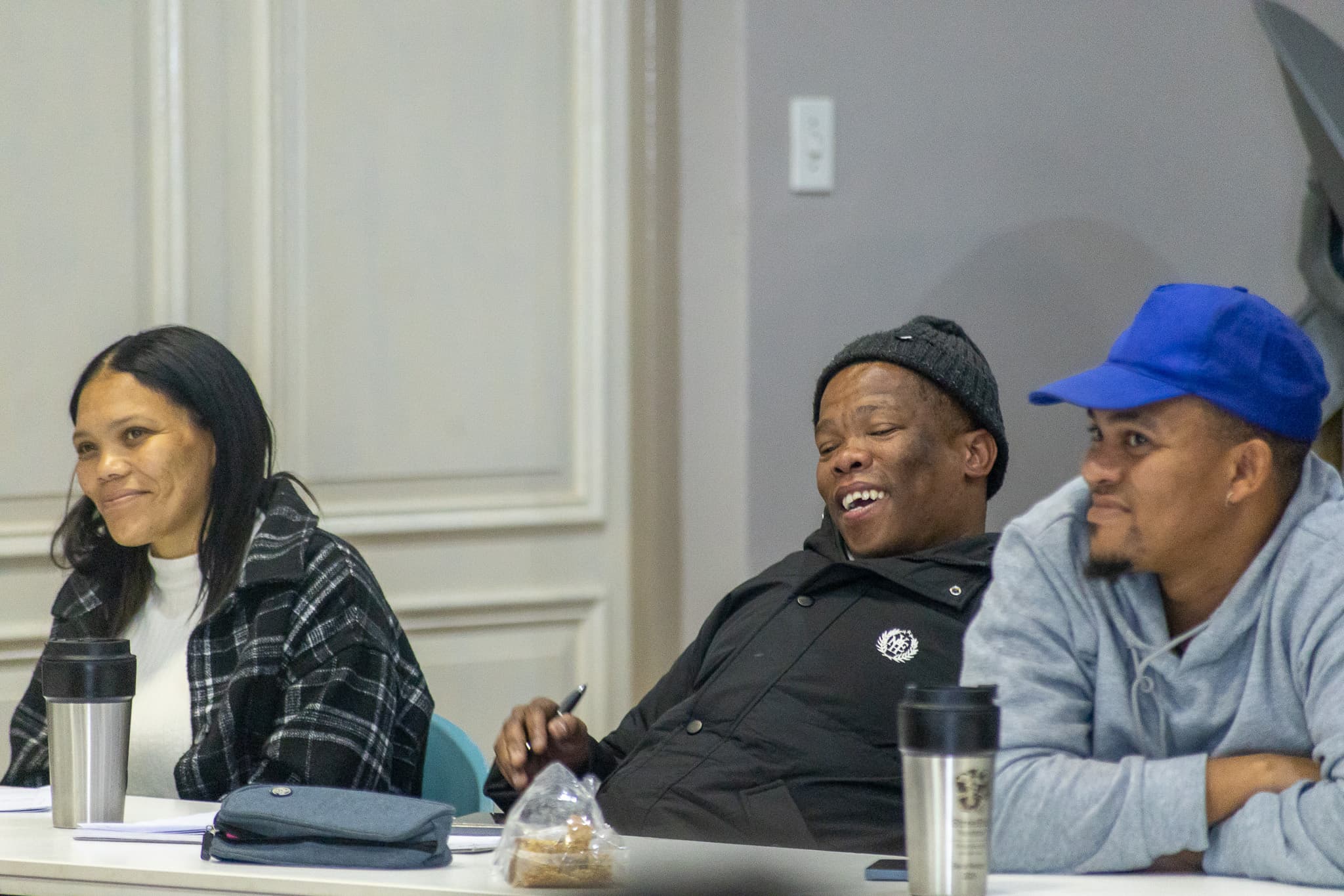 Young changemakers smiling during an interactive workshop