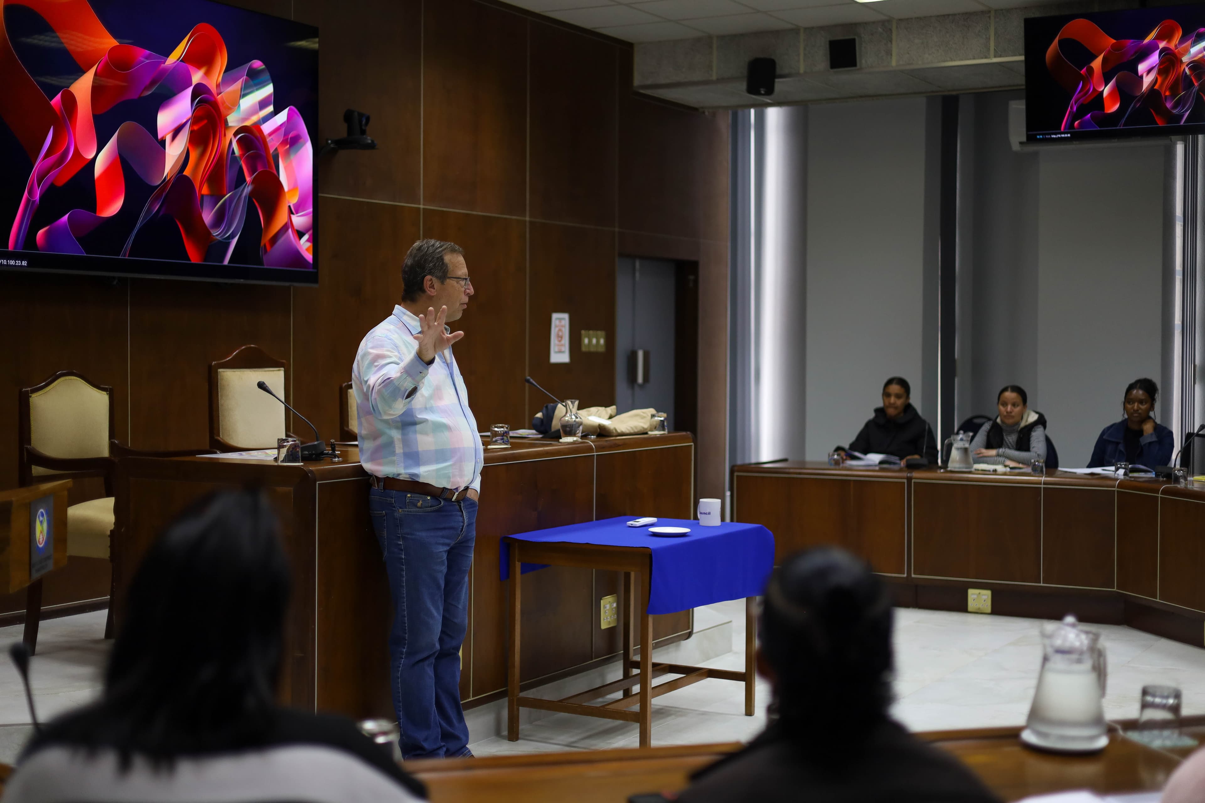 Dr. Nico presenting to municipal council leadership and partners