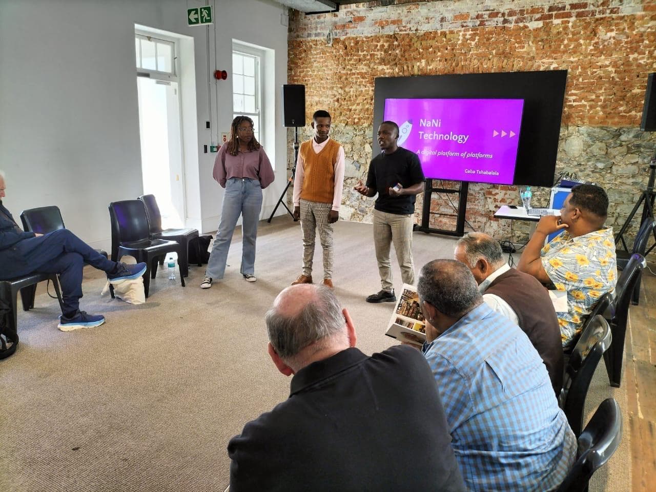 Young changemakers presenting social technology solutions to partners