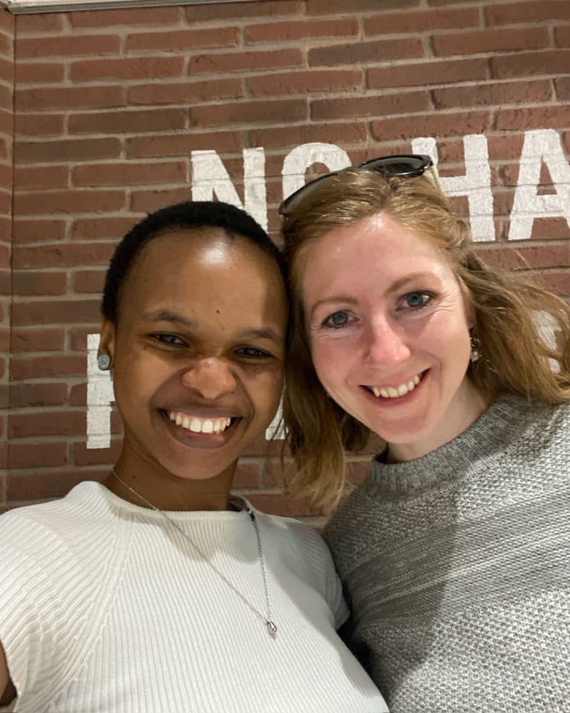Nelson mentee and European dolphin mentor smiling warmly together
